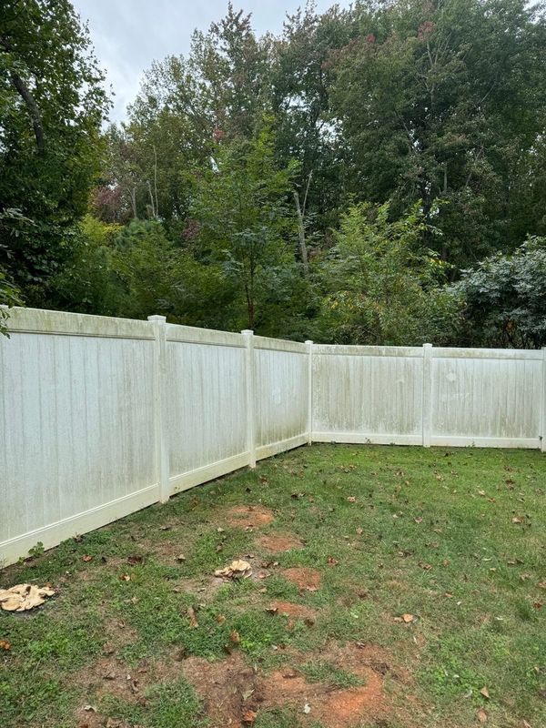 Fence before pressure washing